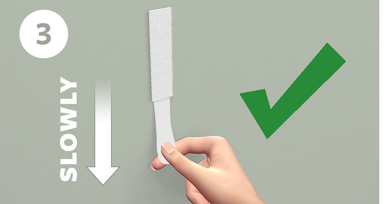 STep 3 - Stretch strips slowly against the wall at least 15 inches (38 cm) to release.
